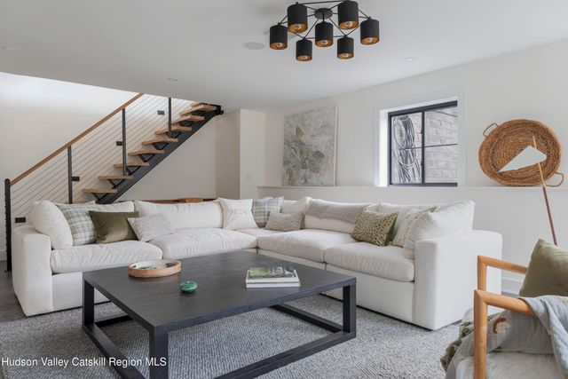 a view of a dining room with furniture and a table