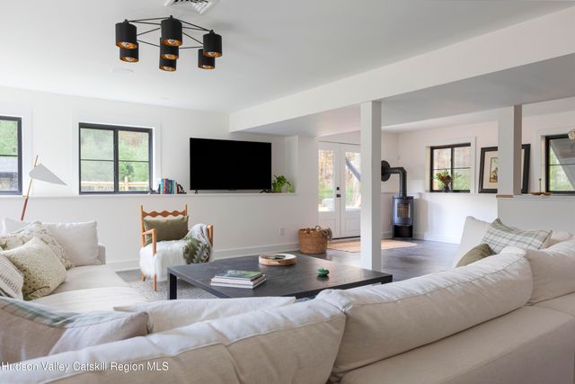 a kitchen with white cabinets sink and stainless steel appliances
