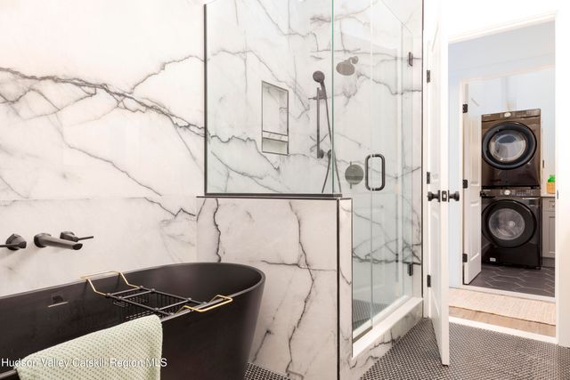 a view of a patio with table and chairs and wooden floor