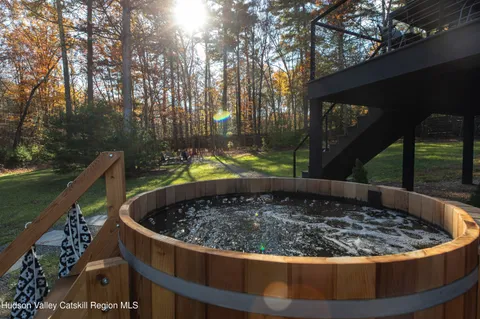 a view of a jacuzzi with a bench in a patio
