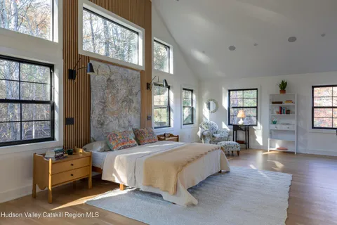 a view of livingroom with furniture and floor to ceiling window