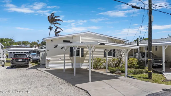 a view of a cars park in front of house
