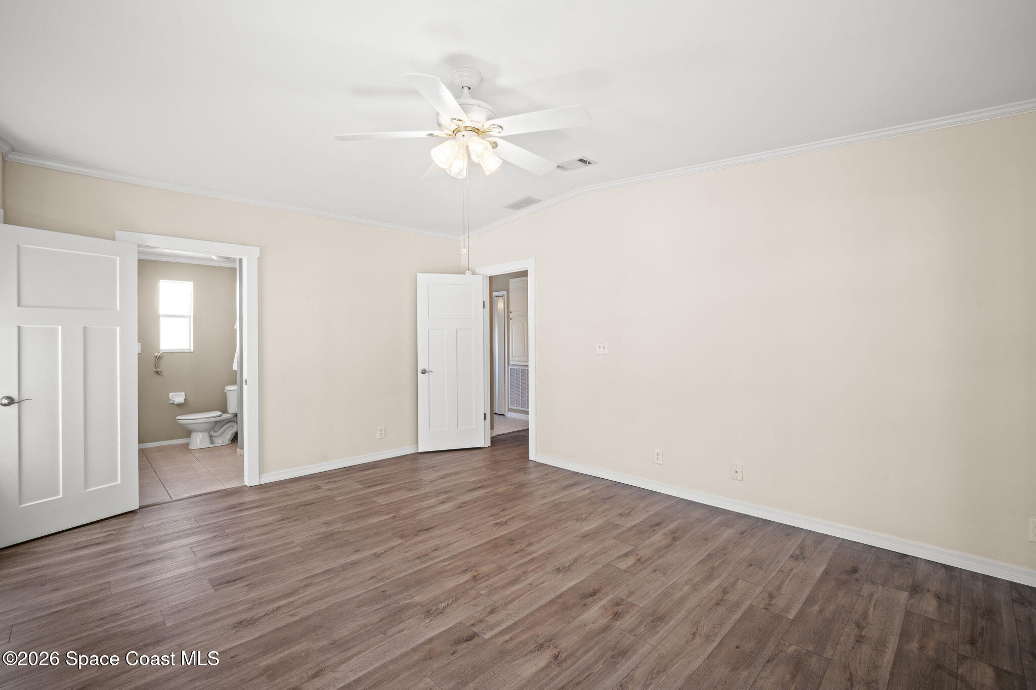 2966 Indian River Drive Northeast Palm Bay, FL 32905 - Photo 18 of 31 wooden floor in an empty room