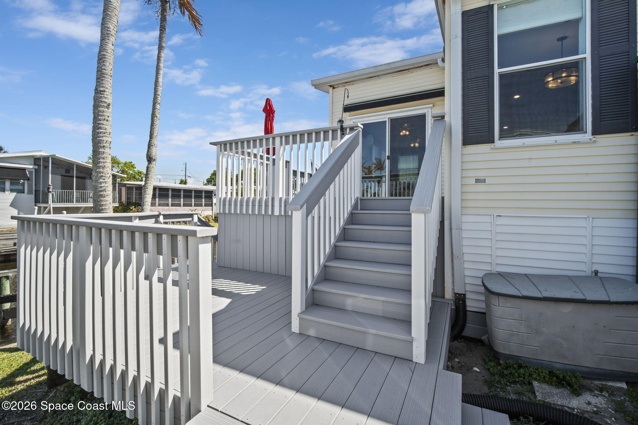 2966 Indian River Drive Northeast Palm Bay, FL 32905 - Photo 23 of 31 a view of balcony with wooden floor