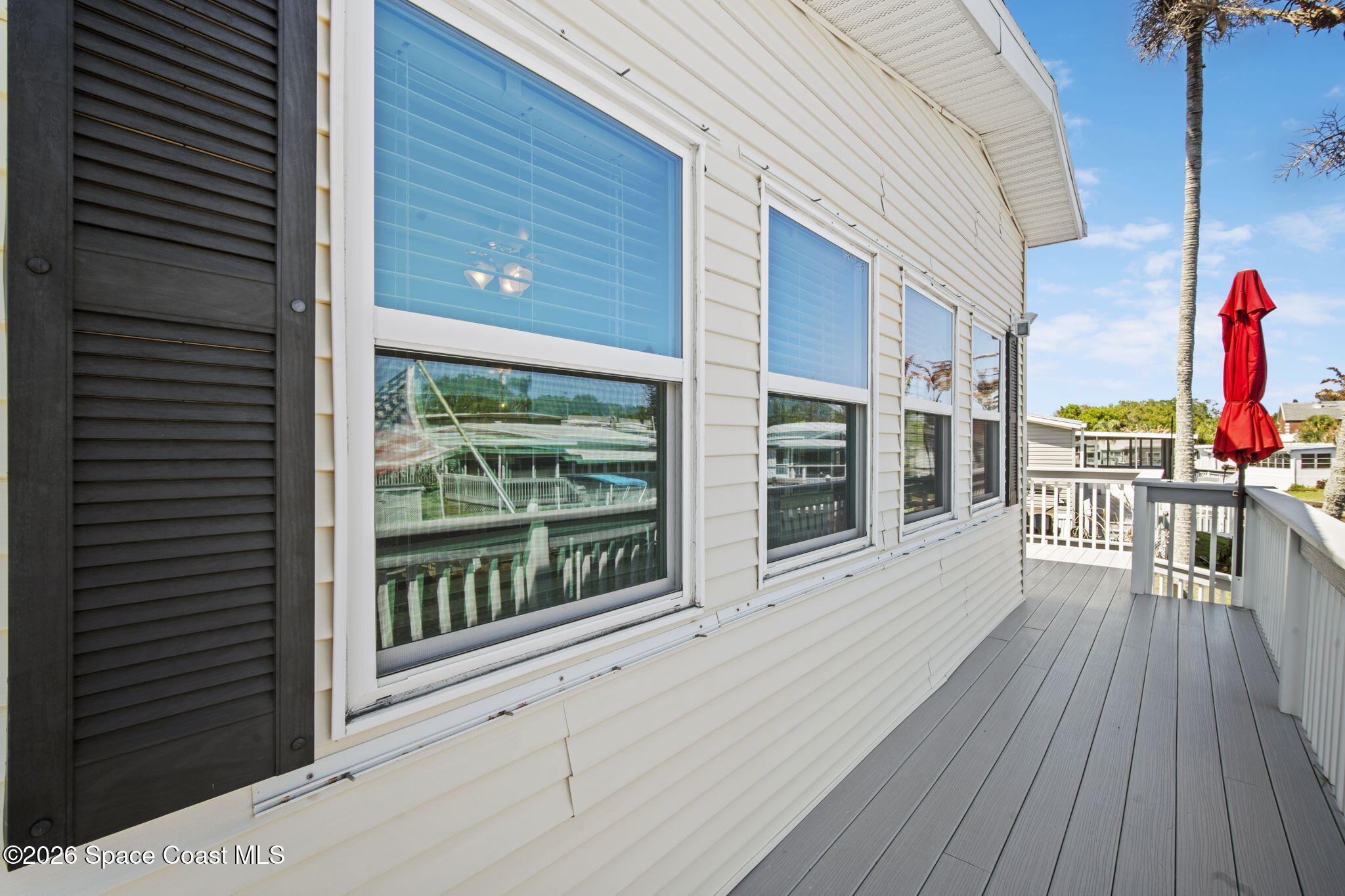 2966 Indian River Drive Northeast Palm Bay, FL 32905 - Photo 25 of 31 a view of a house with a roof deck