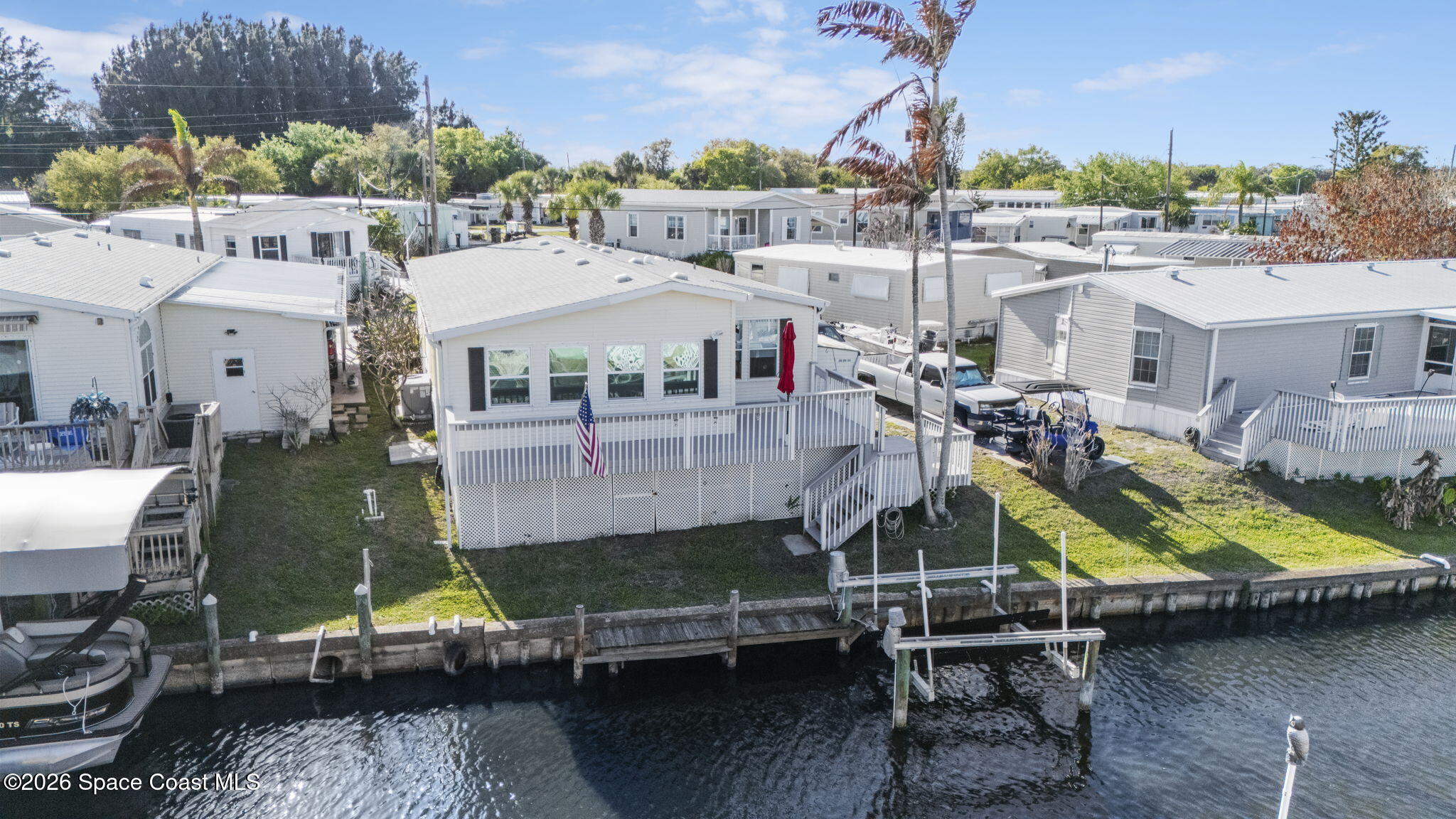 2966 Indian River Drive Northeast Palm Bay, FL 32905 - Photo 27 of 31 an aerial view of a house with swimming pool
