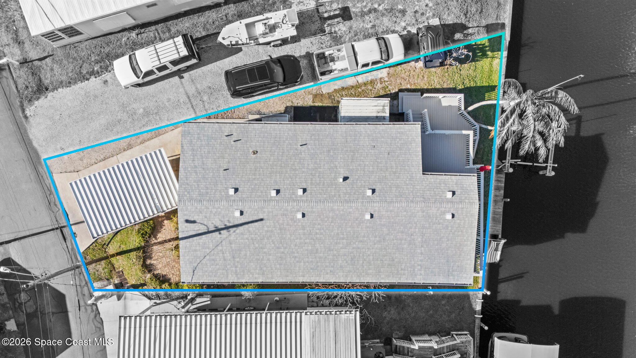 2966 Indian River Drive Northeast Palm Bay, FL 32905 - Photo 28 of 31 a house with trees in front of it