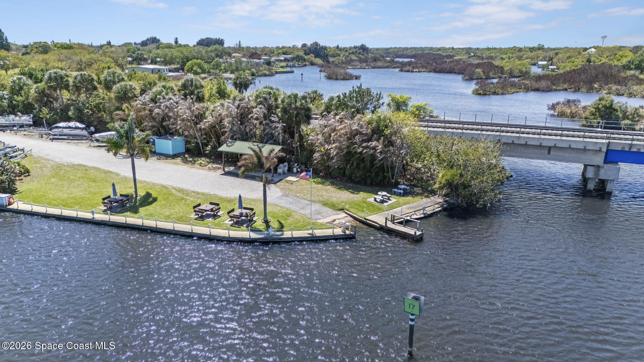2966 Indian River Drive Northeast Palm Bay, FL 32905 - Photo 30 of 31 an aerial view of a house with a yard and lake view