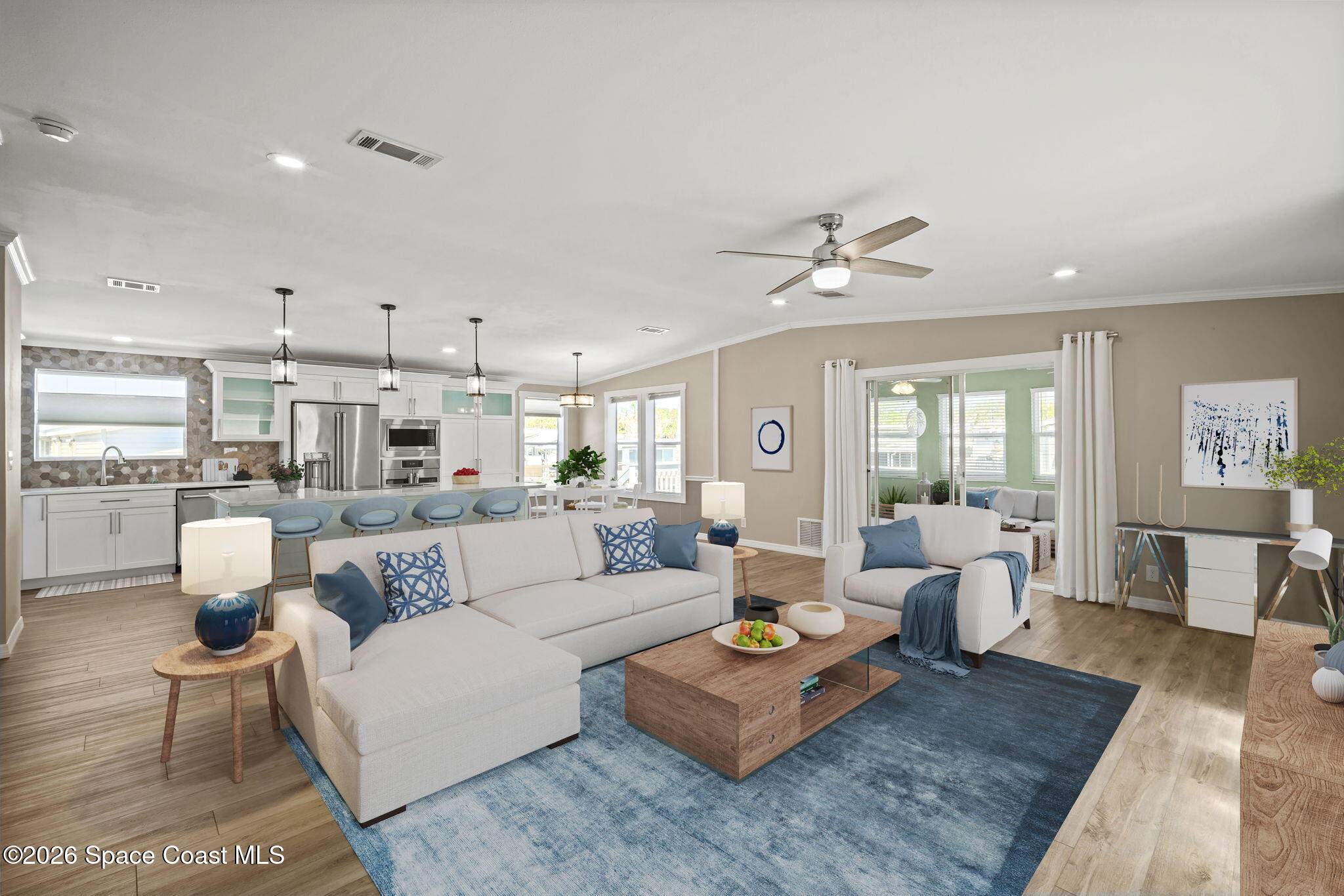 2966 Indian River Drive Northeast Palm Bay, FL 32905 - Photo 4 of 31 a living room with furniture kitchen view and a chandelier