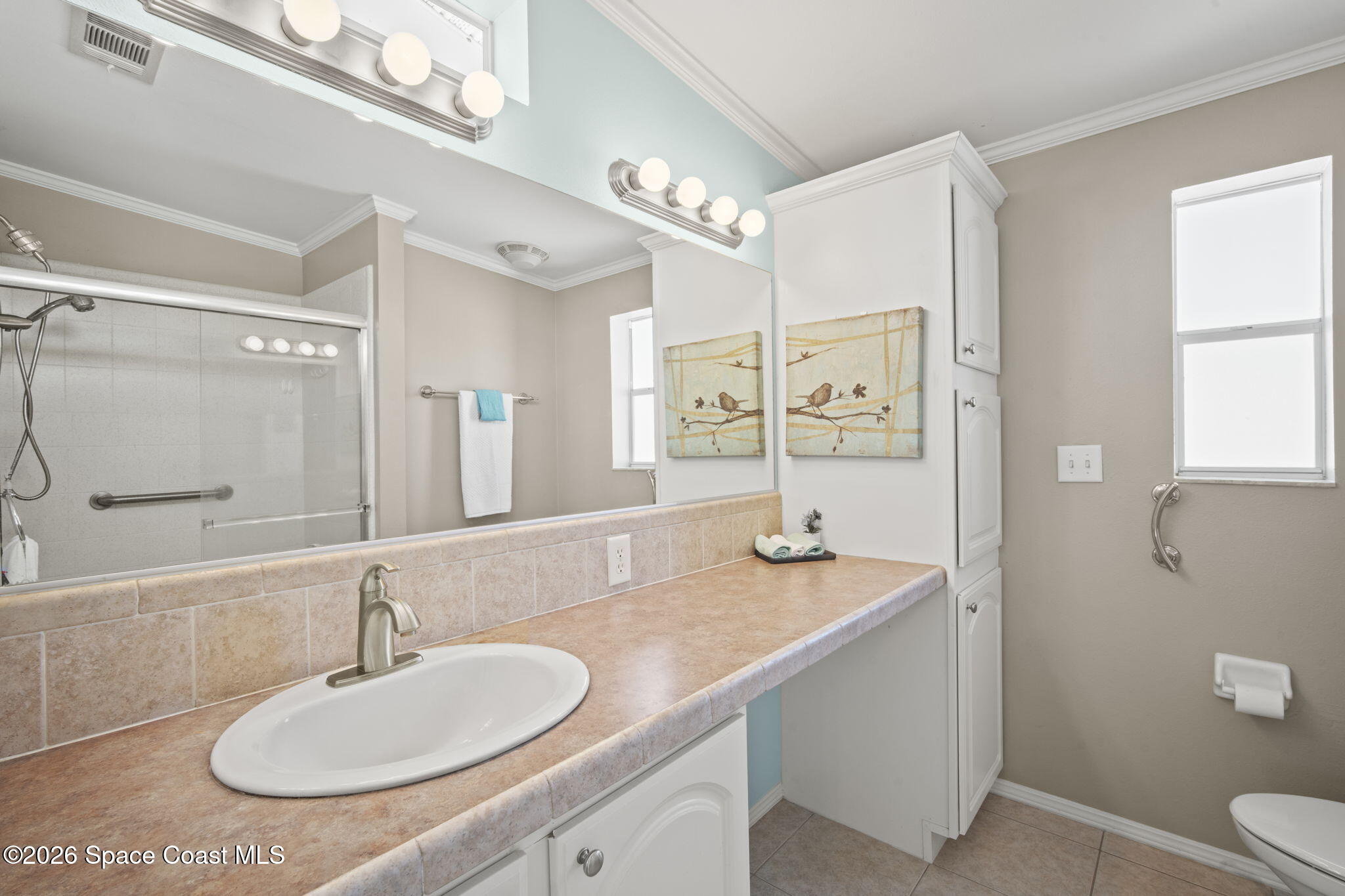 2966 Indian River Drive Northeast Palm Bay, FL 32905 - Photo 8 of 31 a bathroom with a granite countertop sink and a mirror