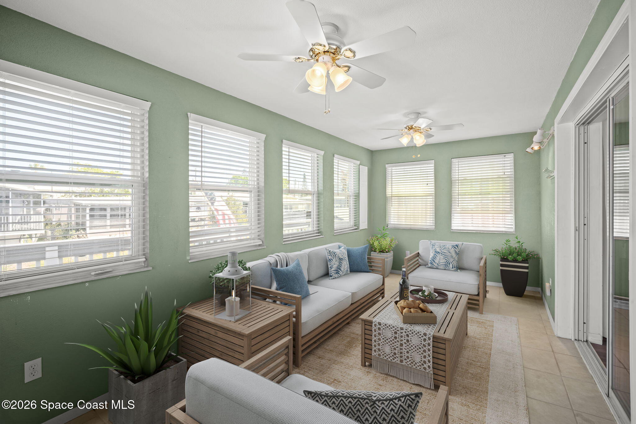 2966 Indian River Drive Northeast Palm Bay, FL 32905 - Photo 9 of 31 a living room with furniture and a large window