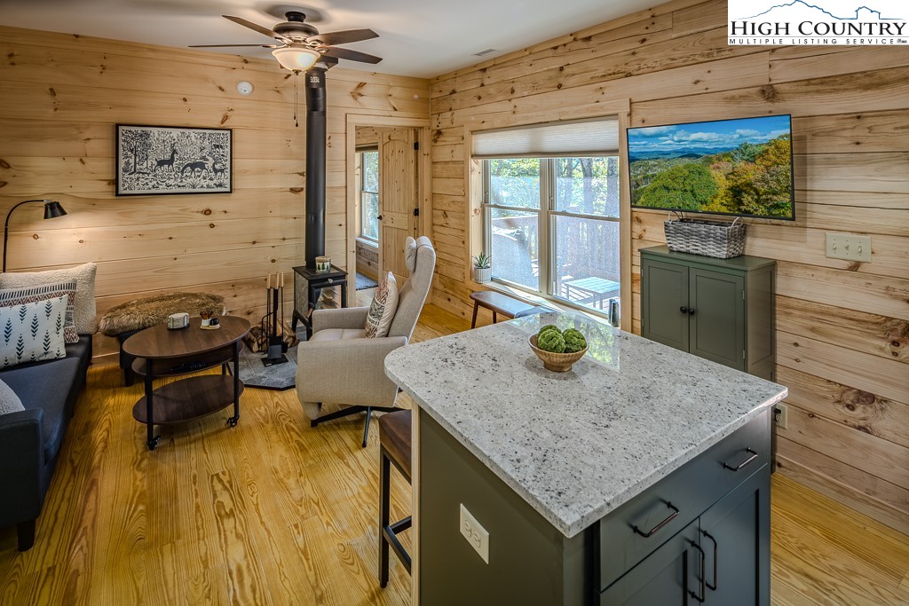 225 Oak Road Beech Mountain, NC 28604 - Photo 16 of 31 a kitchen with a sink a counter top space and stainless steel appliances