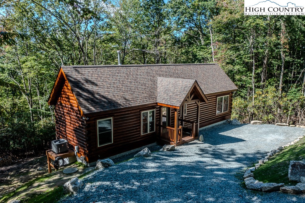 225 Oak Road Beech Mountain, NC 28604 - Photo 28 of 31 a view of a house with a yard