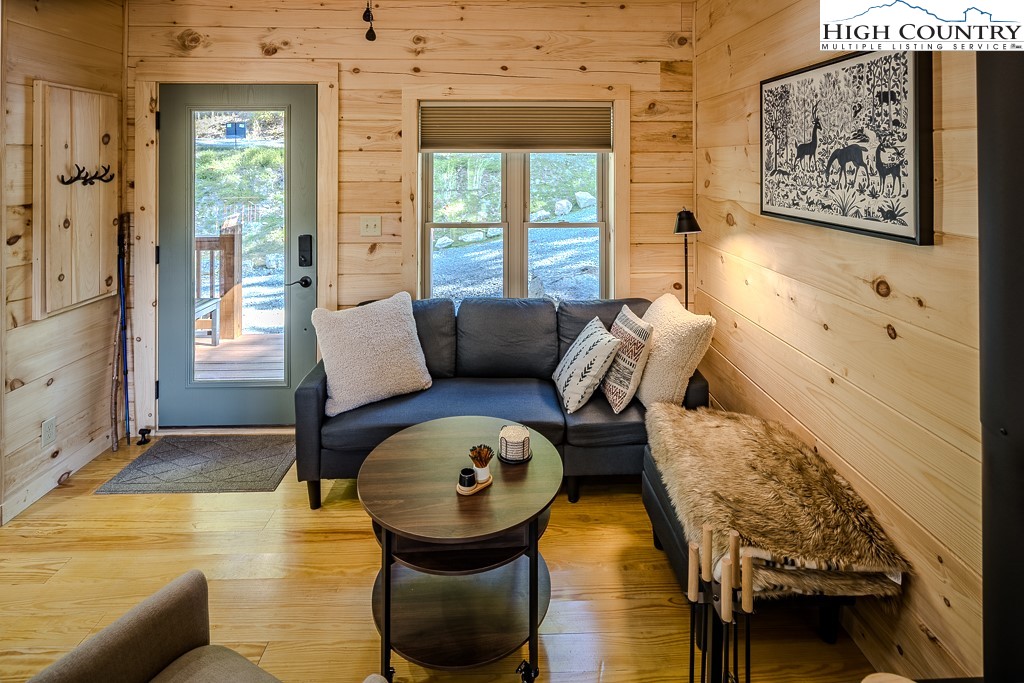 225 Oak Road Beech Mountain, NC 28604 - Photo 9 of 31 a living room with furniture and a large window