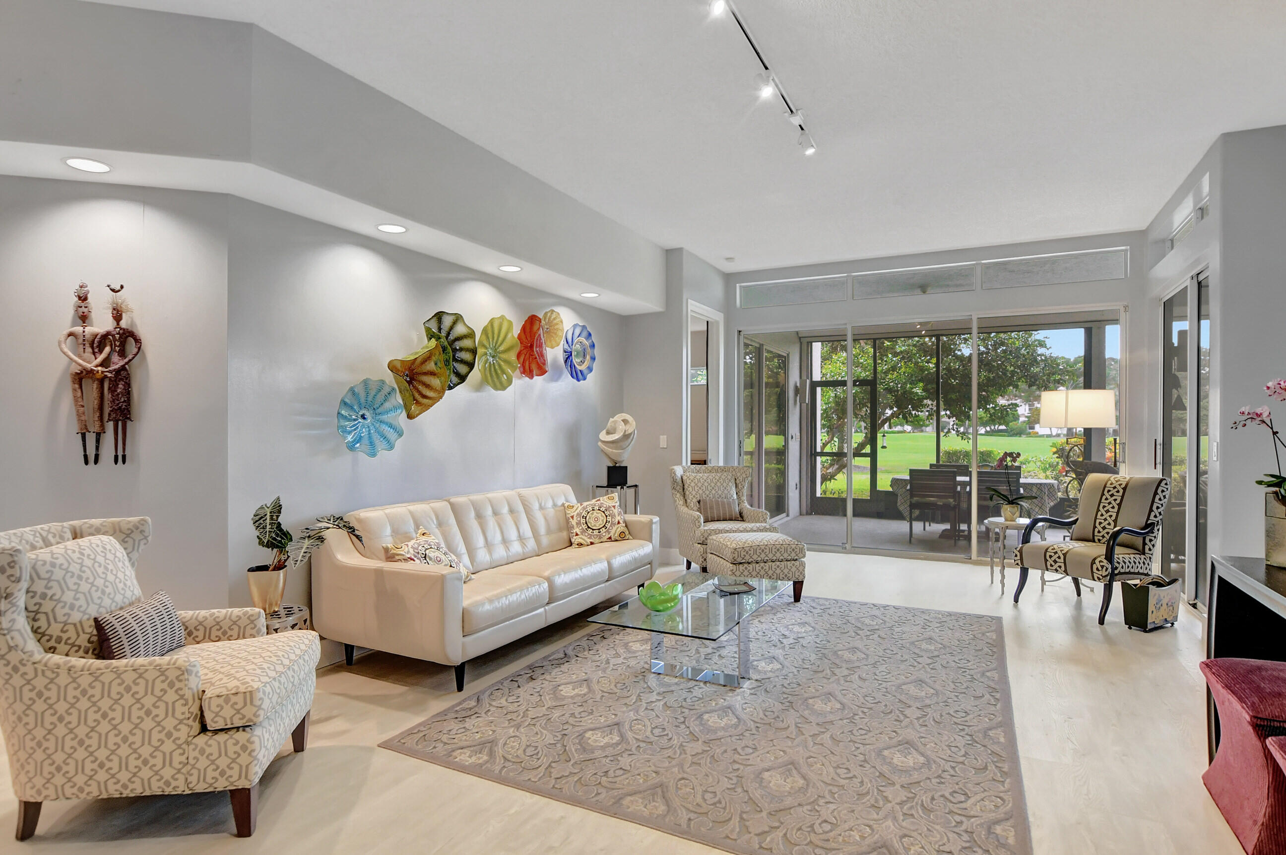 5801 Northwest 24th Avenue, Unit 1004 Boca Raton, FL 33496 - Photo 20 of 65 a living room with furniture and a large window
