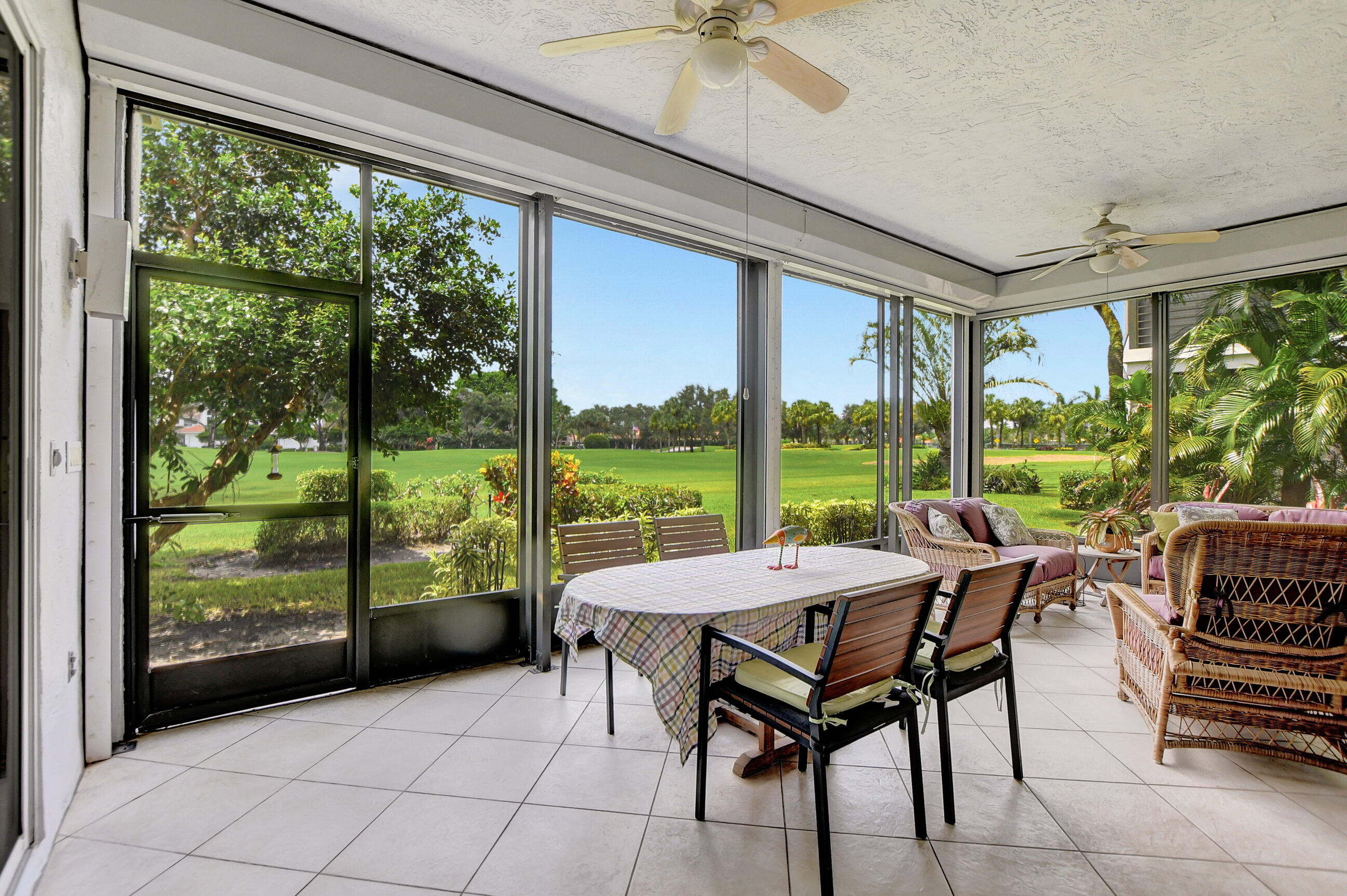 5801 Northwest 24th Avenue, Unit 1004 Boca Raton, FL 33496 - Photo 27 of 65 a room with furniture and large windows