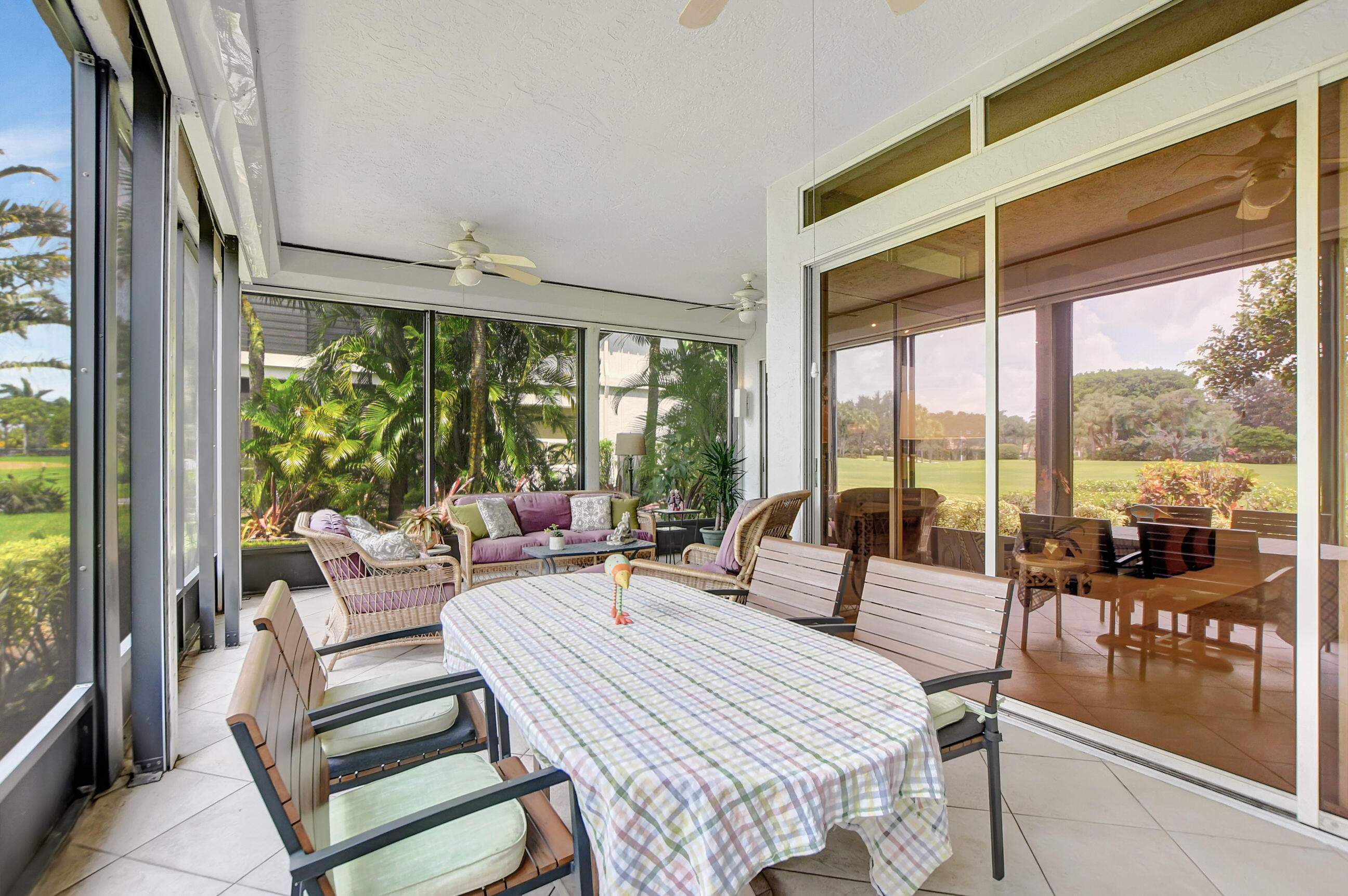 5801 Northwest 24th Avenue, Unit 1004 Boca Raton, FL 33496 - Photo 28 of 65 a living room with furniture and a floor to ceiling window