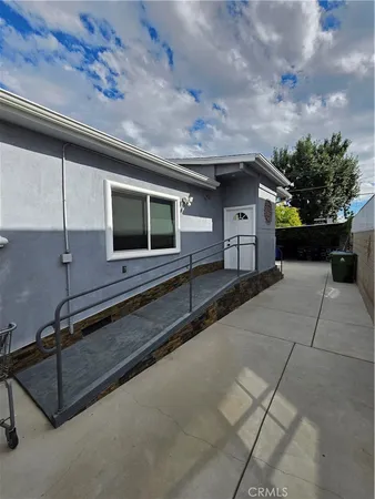 a view of a car park in front of house
