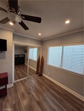 a view of a room with gym equipment and a large window