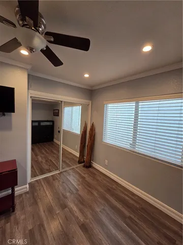 a view of a room with gym equipment and a large window