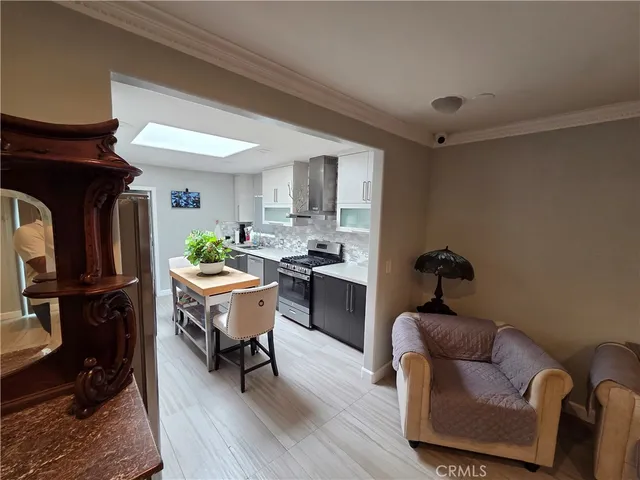 a living room with furniture and a piano