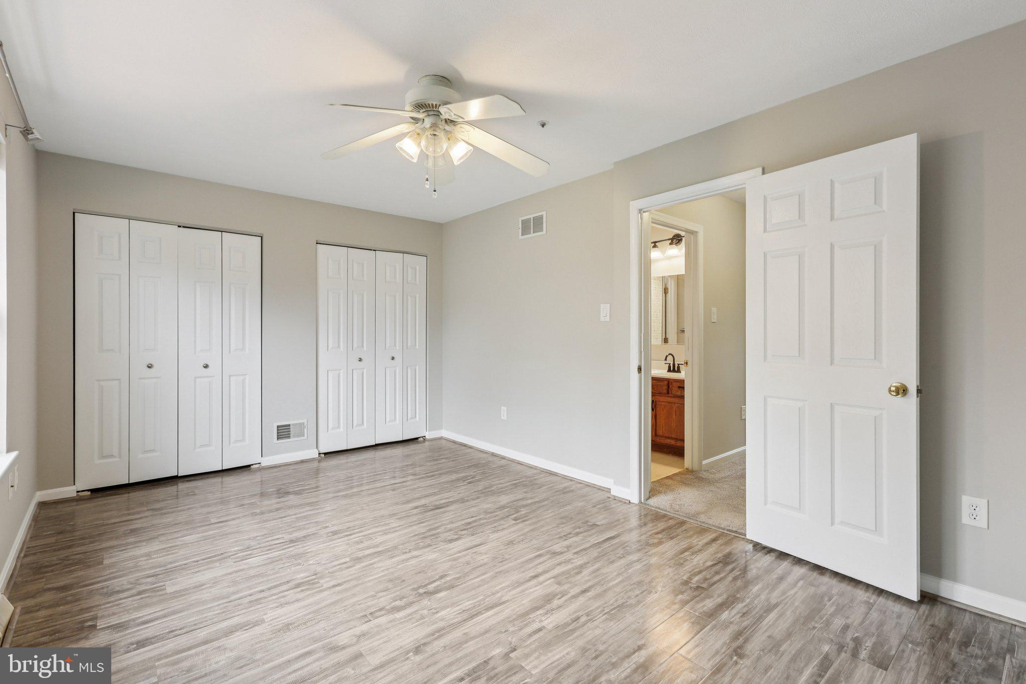 4642 Marksman Court Hampstead, MD 21074 - Photo 13 of 35 a view of an empty room with wooden floor