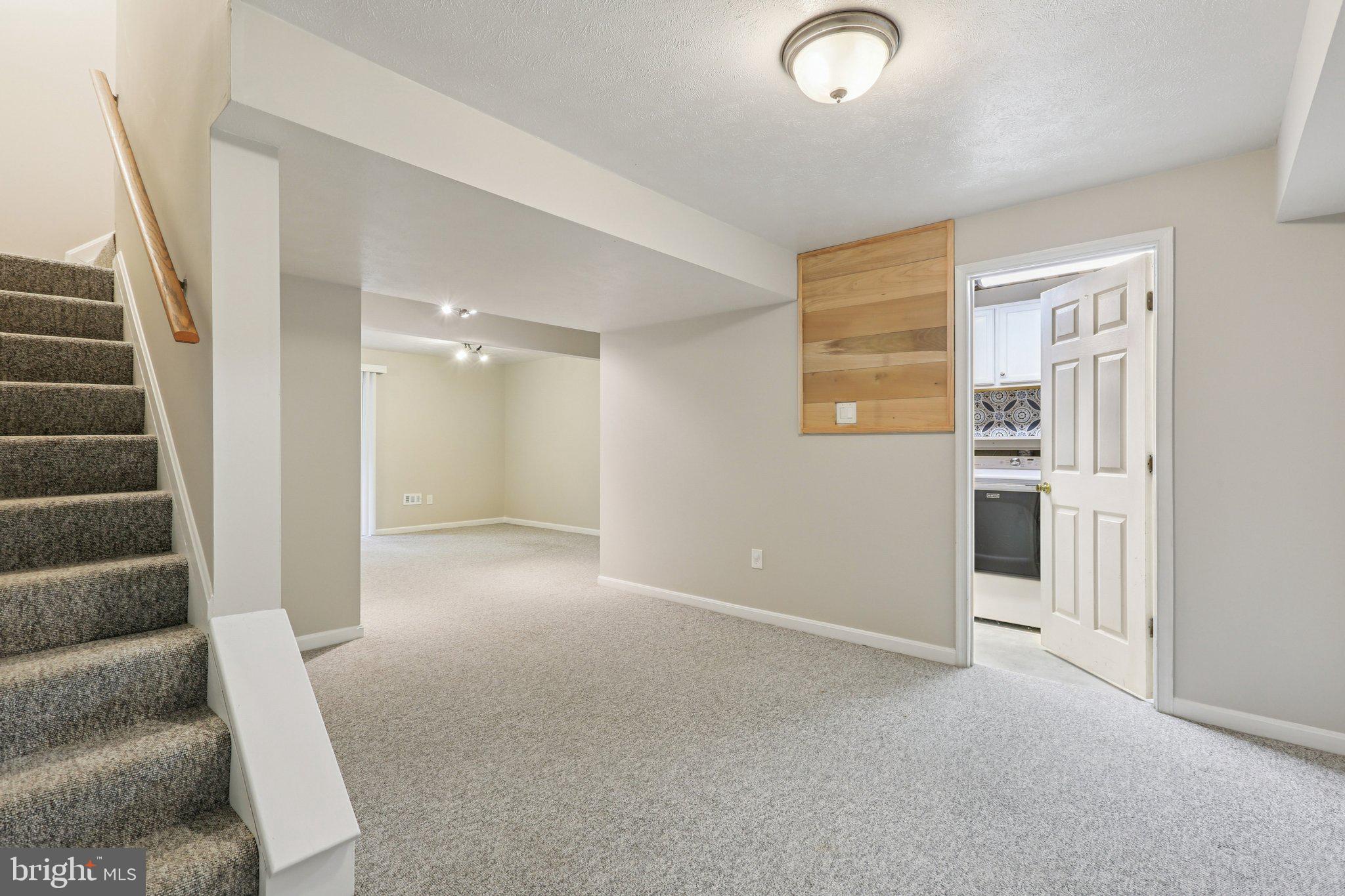 4642 Marksman Court Hampstead, MD 21074 - Photo 21 of 35 a view of an empty room with stairs and ventilation