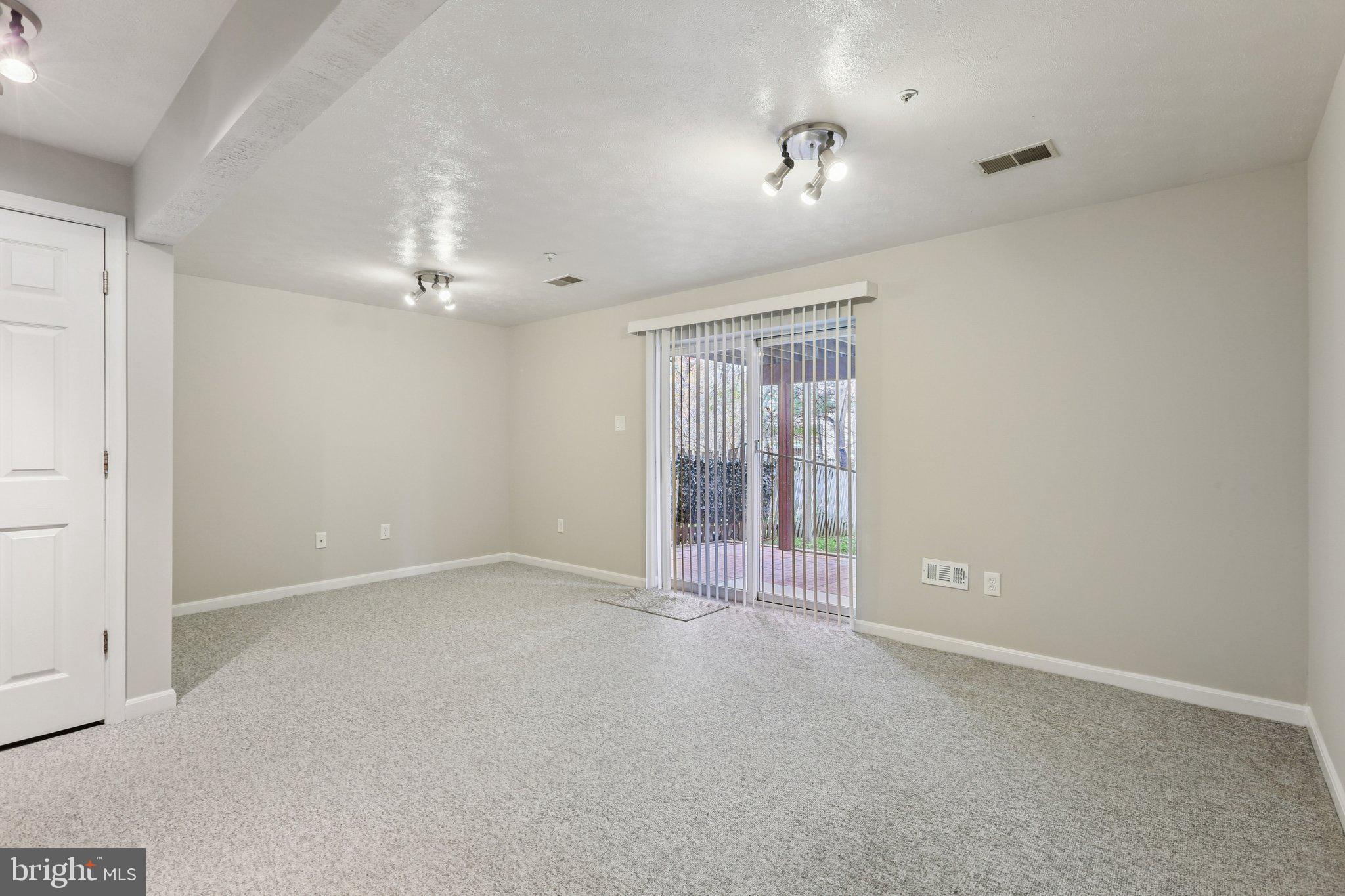 4642 Marksman Court Hampstead, MD 21074 - Photo 22 of 35 a view of an empty room with a window