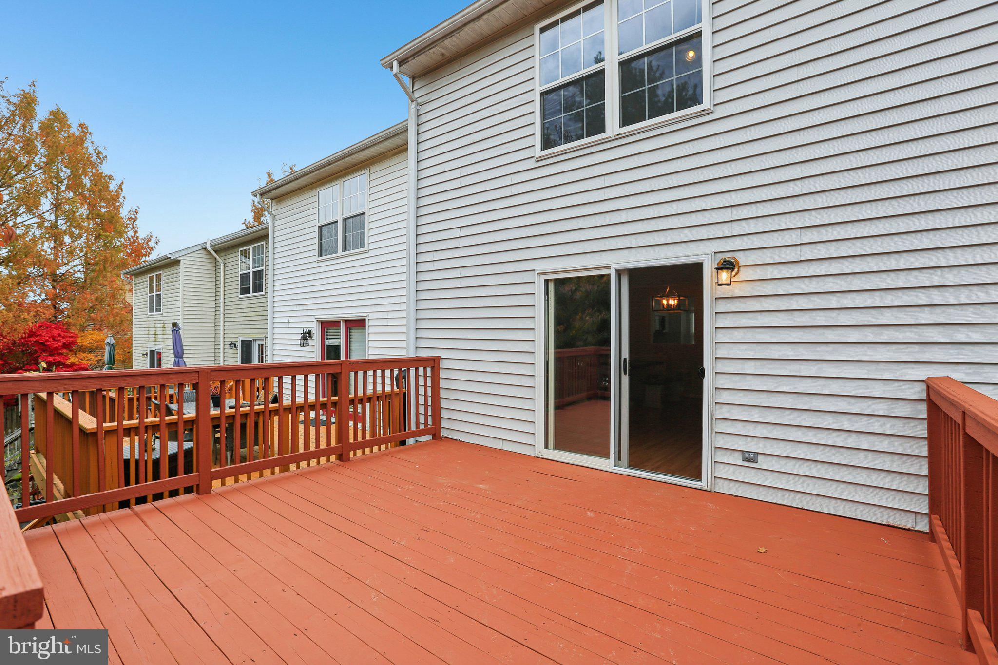 4642 Marksman Court Hampstead, MD 21074 - Photo 25 of 35 a view of a house with wooden deck