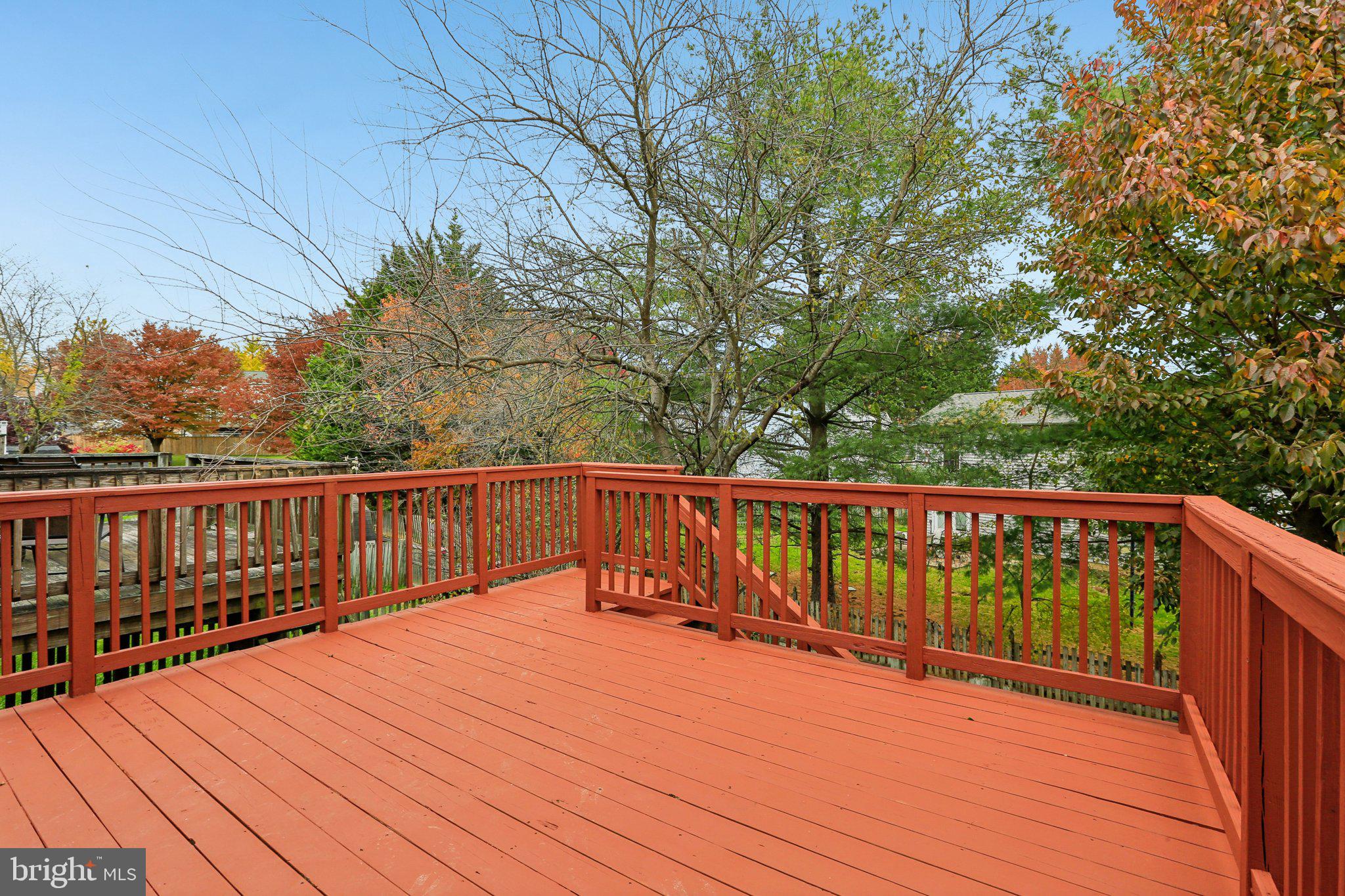 4642 Marksman Court Hampstead, MD 21074 - Photo 26 of 35 a balcony with wooden floor and trees in the back