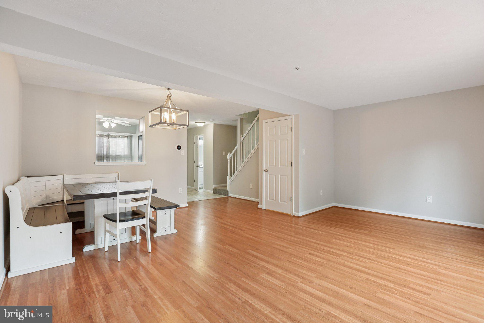 4642 Marksman Court Hampstead, MD 21074 - Photo 4 of 35 a view of a dining room with furniture and wooden floor