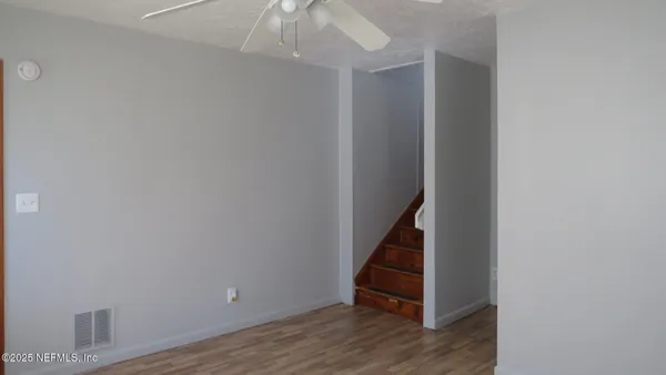 a view of entryway with wooden floor