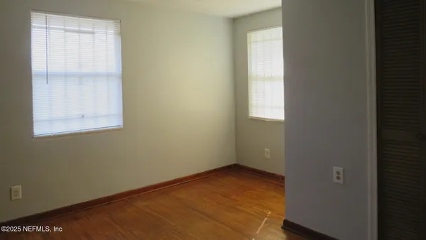 an empty room with windows