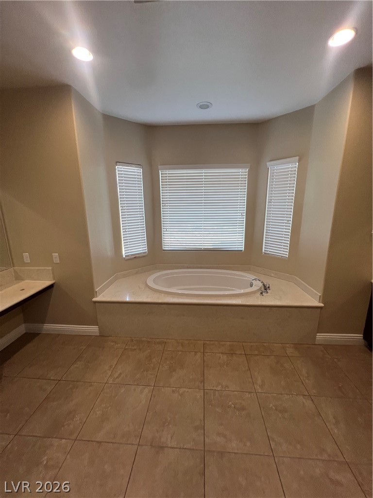 Undisclosed Address Las Vegas, NV 89129 - Photo 22 of 33 Bathroom featuring a bath, vanity, recessed lighting, and light tile patterned flooring
