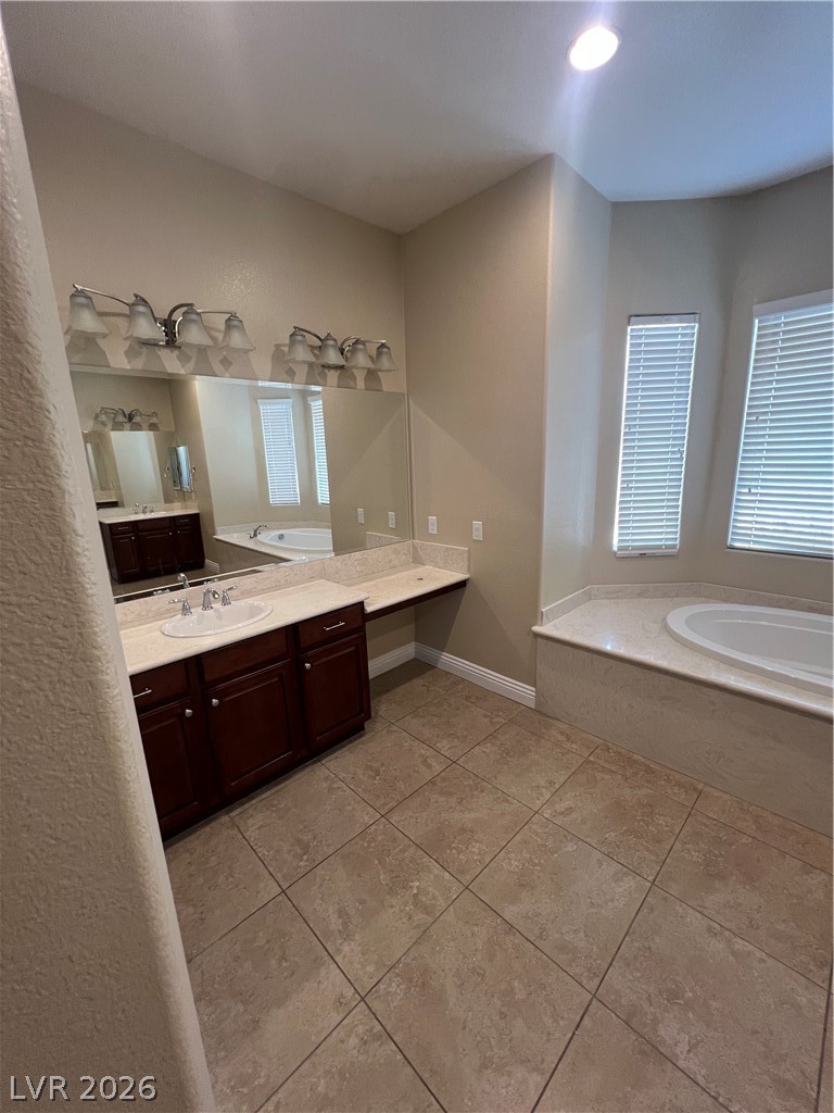 Undisclosed Address Las Vegas, NV 89129 - Photo 23 of 33 Full bathroom with a garden tub, vanity, and light tile patterned floors