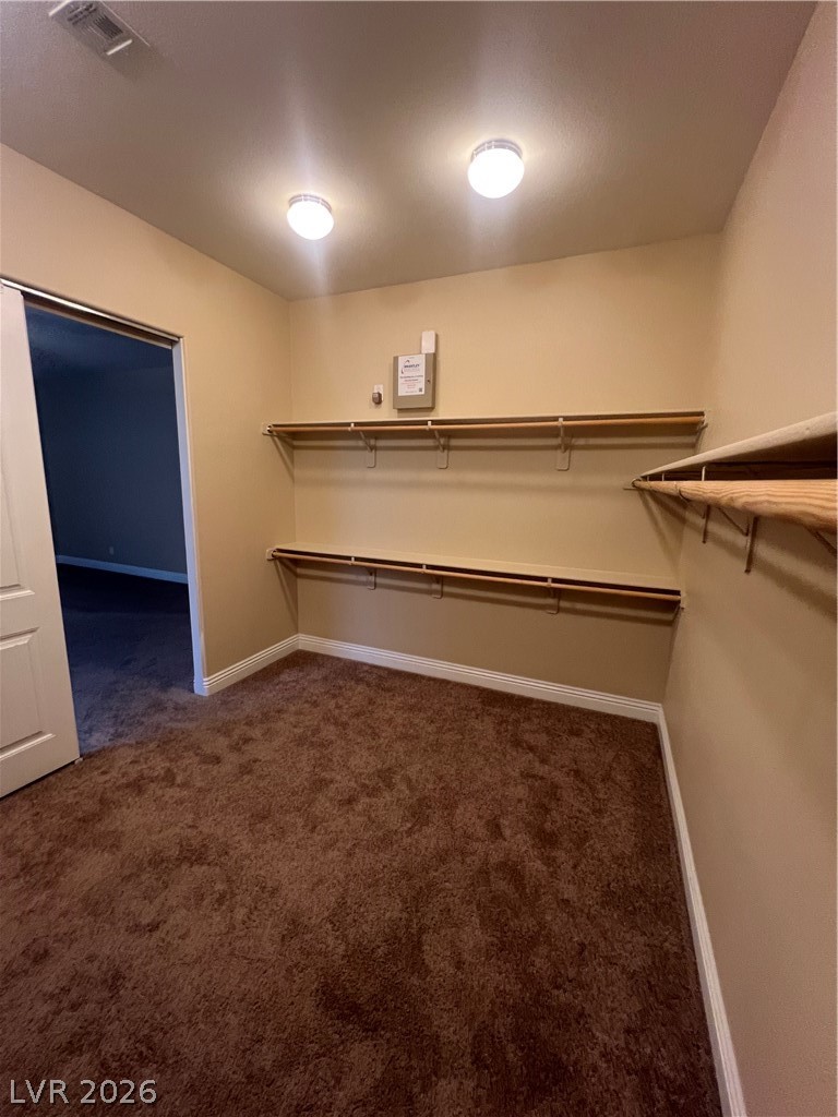 Undisclosed Address Las Vegas, NV 89129 - Photo 24 of 33 Walk in closet with dark colored carpet