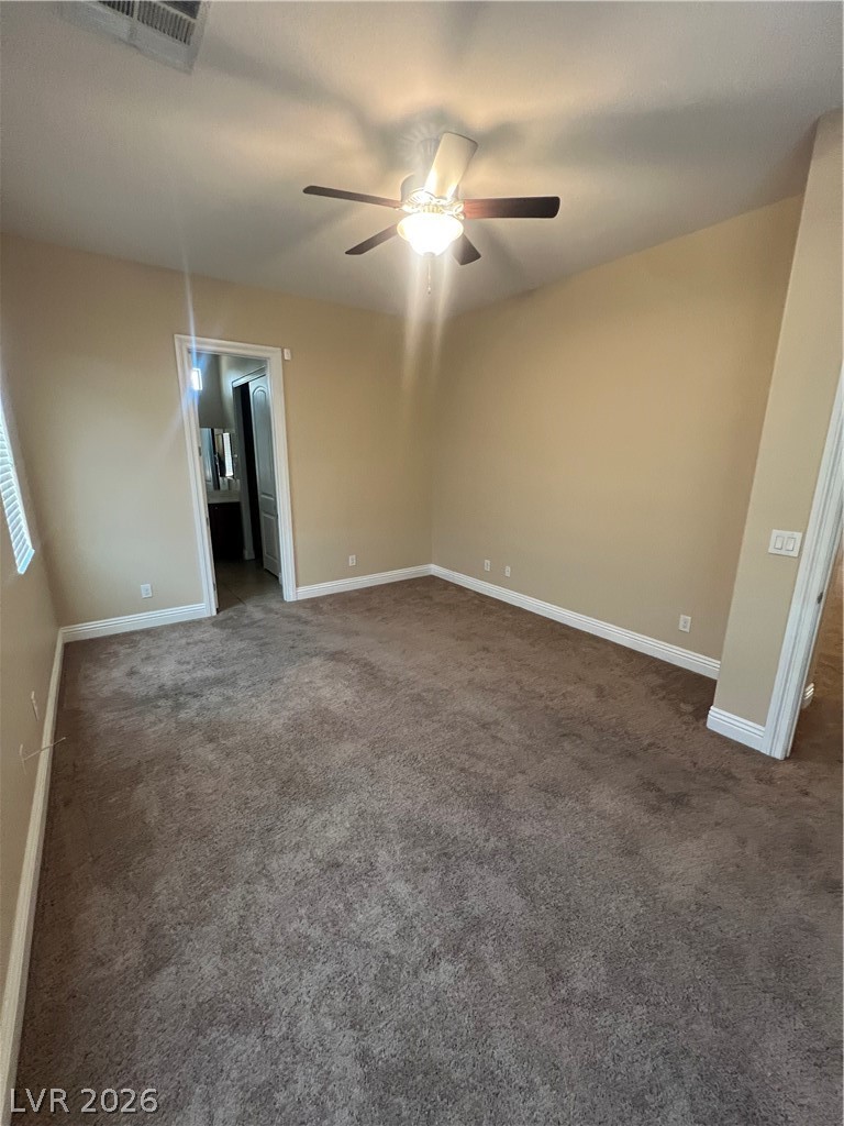 Undisclosed Address Las Vegas, NV 89129 - Photo 29 of 33 Spare room with tan
carpet and a ceiling fan