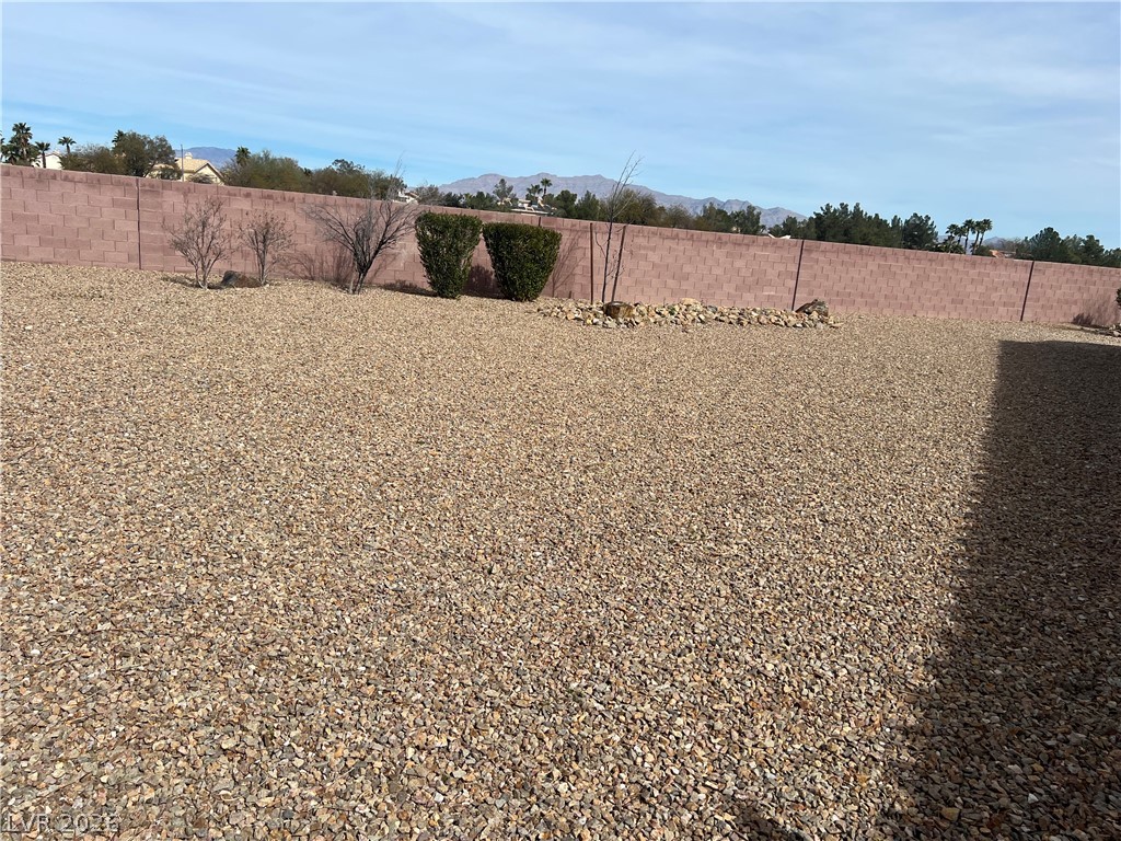 Undisclosed Address Las Vegas, NV 89129 - Photo 5 of 33 Fenced backyard with a mountain view