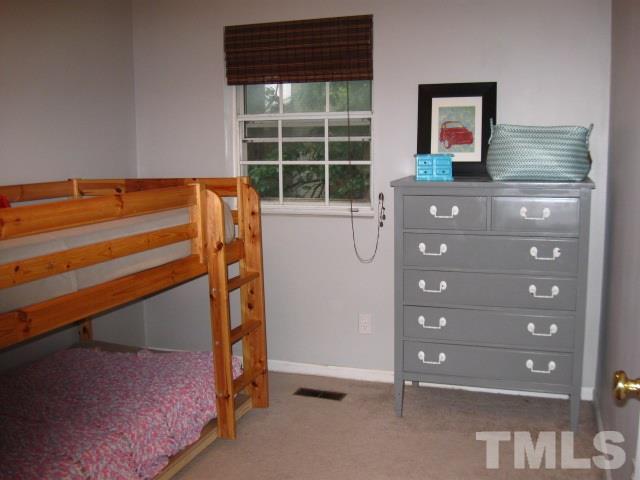 6455 New Market Way Raleigh, NC 27615 - Photo 11 of 18 a view of room with window and a ceiling fan