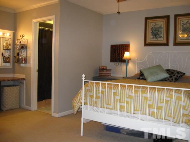 6455 New Market Way Raleigh, NC 27615 - Photo 14 of 18 a bedroom with bed and a window