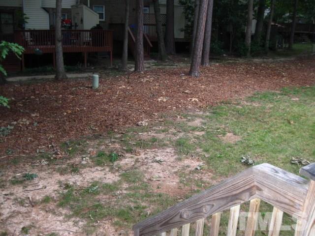6455 New Market Way Raleigh, NC 27615 - Photo 17 of 18 a view of a house with backyard