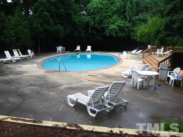 6455 New Market Way Raleigh, NC 27615 - Photo 18 of 18 a view of a backyard with table and chairs