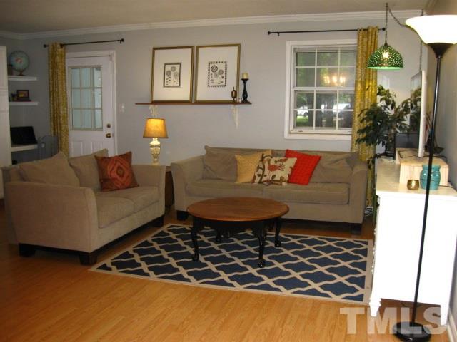 6455 New Market Way Raleigh, NC 27615 - Photo 8 of 18 a living room with furniture and a window
