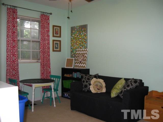 6455 New Market Way Raleigh, NC 27615 - Photo 10 of 18 a living room with furniture and a window