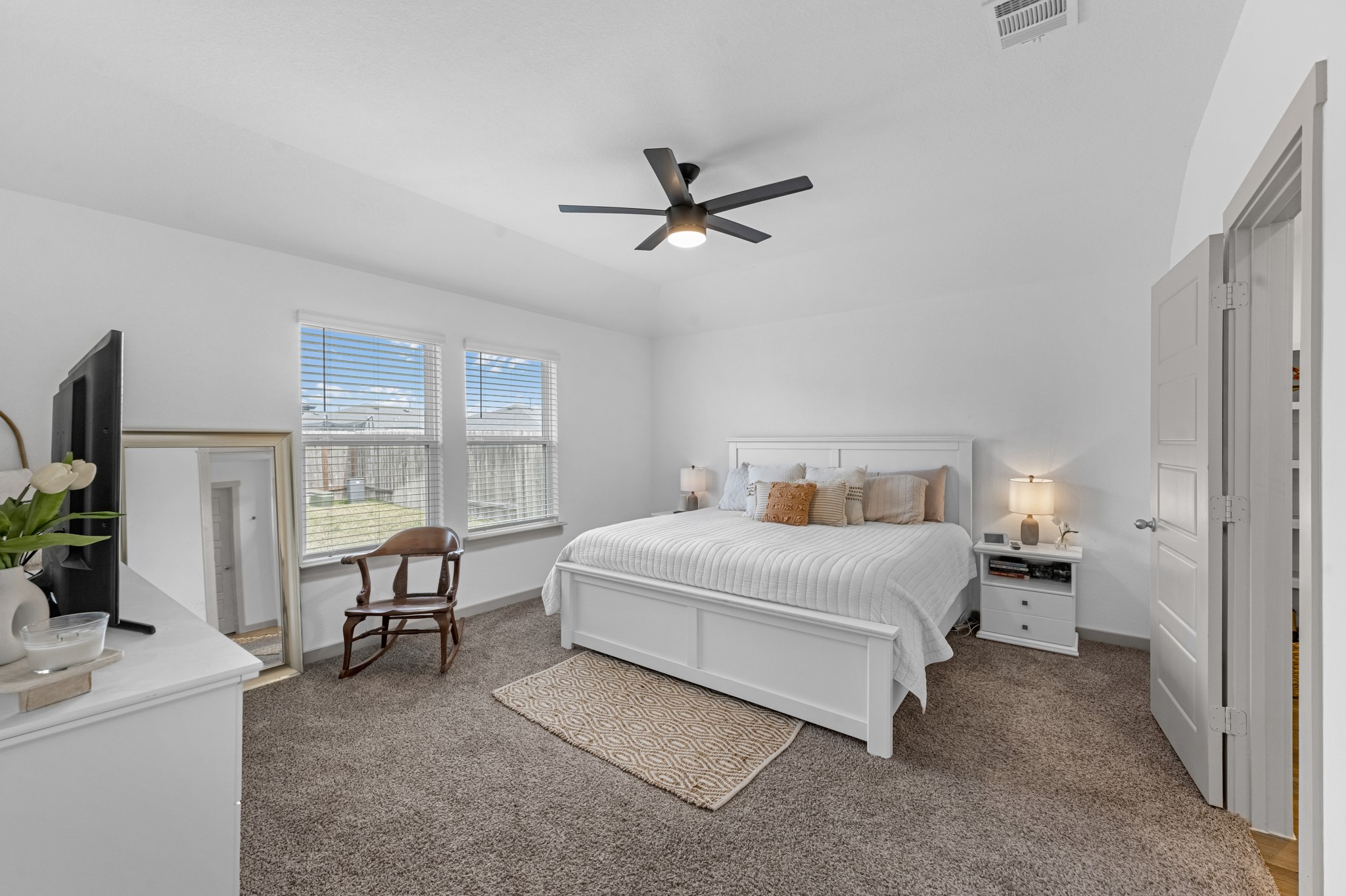 1103 Texel Street Rosharon, TX 77583 - Photo 11 of 33 a spacious bedroom with a bed and a desk