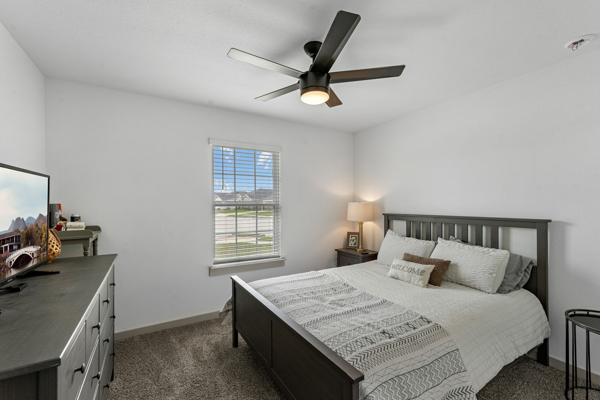 1103 Texel Street Rosharon, TX 77583 - Photo 21 of 33 a bedroom with a bed and a window