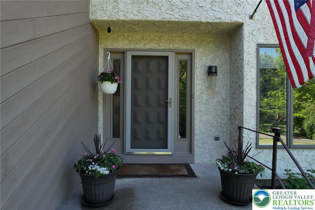3470 Brodhead Road Bethlehem, PA 18020 - Photo 33 of 84 A welcoming entry features a stylish front door framed by decorative planters and a clear storm door.