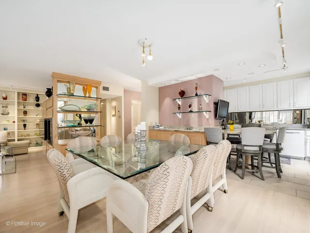 a living room with furniture and a kitchen view