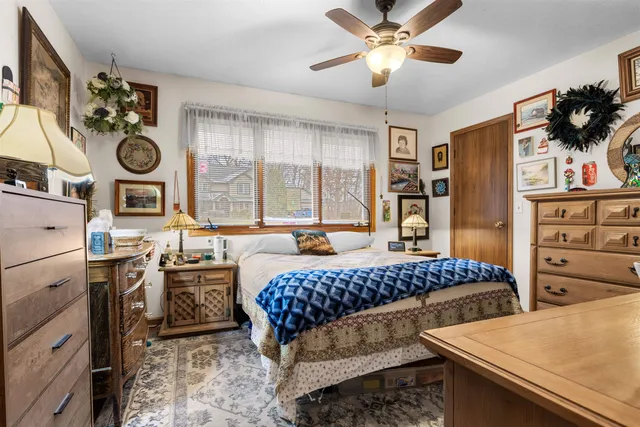 a bedroom with furniture and a window