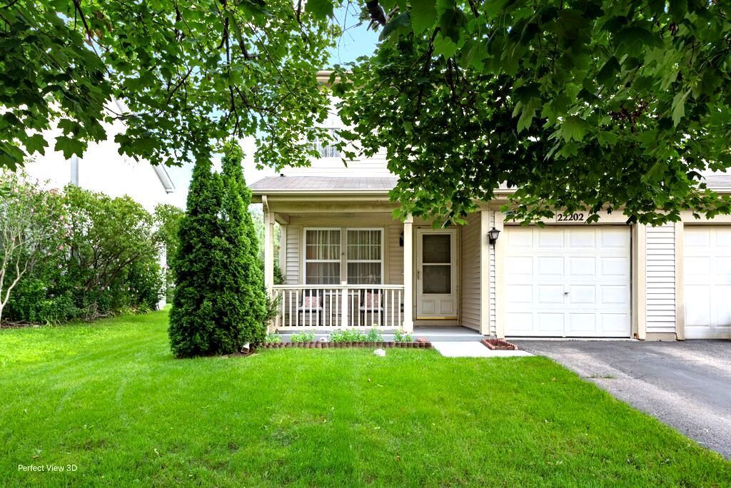 22202 West Niagara Trail, Unit 22202 Plainfield, IL 60544 - Photo 1 of 24 a front view of a house with a garden